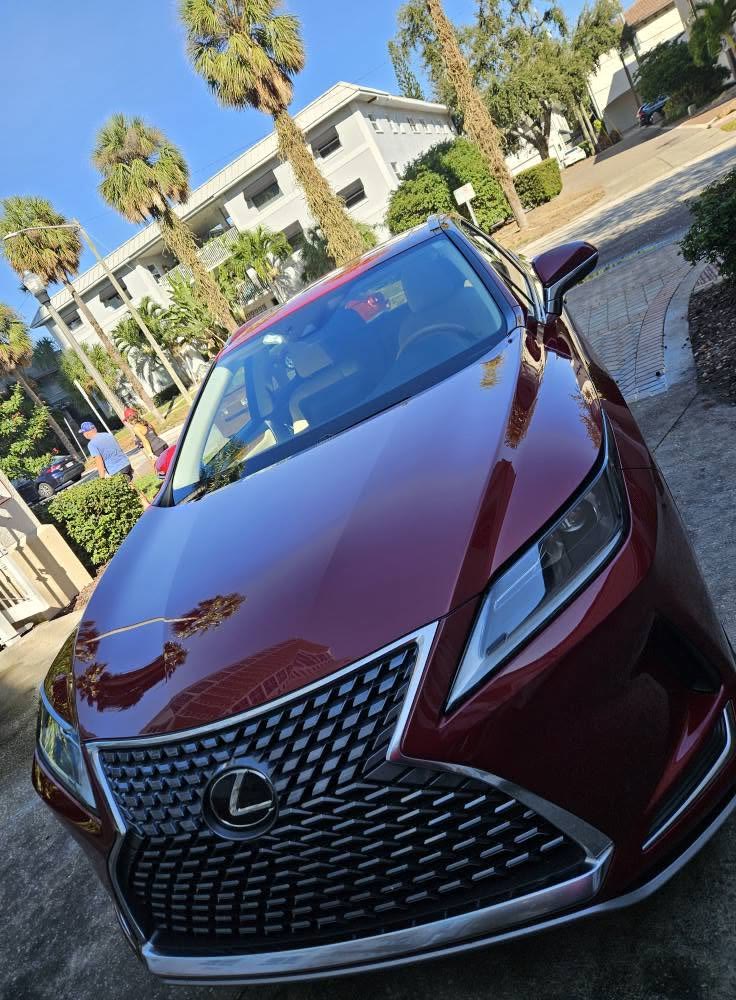 Front of a red Lexus RX with glossy paint