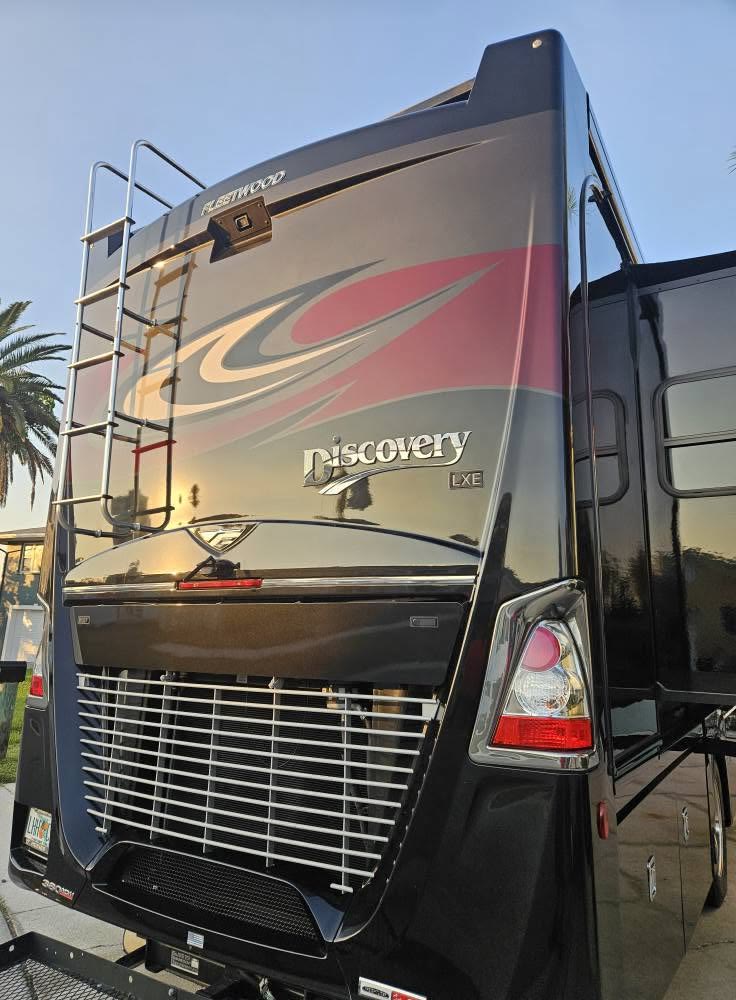 Rear of a Fleetwood Discovery motorcoach, polished